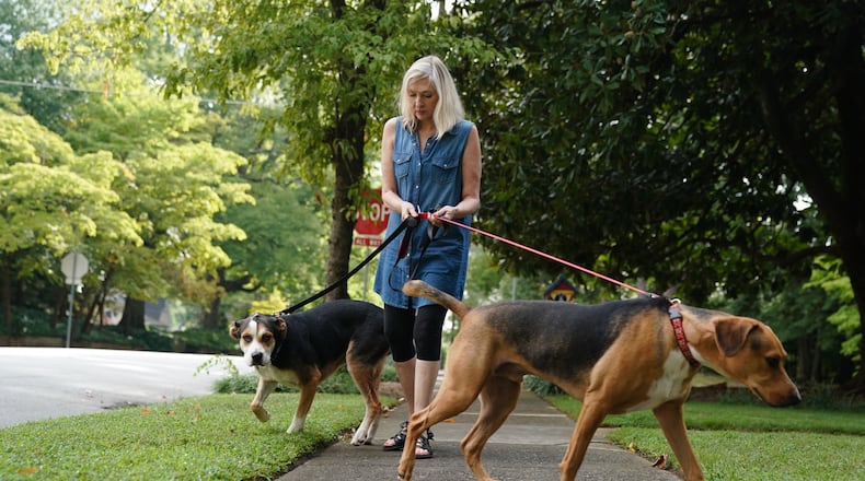 Jean Allred walks her dogs Jack and Molly recently in Marietta. Allred has a plan and money set aside for the care of her two dogs and two cats in her will. ELIJAH NOUVELAGE / FOR THE ATLANTA JOURNAL CONSTITUTION