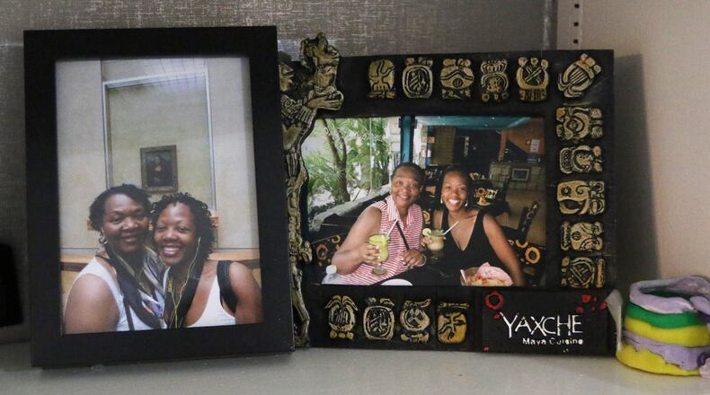 Shelves are lined with photos and memories of Shalon Irving in her home in Sandy Springs. Irving died in 2017 shortly after giving birth. Wanda Irving, her mother, is raising her daughter, Soleil. EMILY HANEY / emily.haney@ajc.com