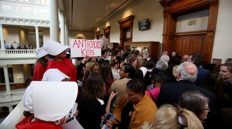 People fill the hallways outside a Georgia Legislature committee room protesting against House Bill 481, the “heartbeat bill” that would outlaw most abortions at about six weeks into a pregnancy. (JASON GETZ/SPECIAL TO THE AJC)