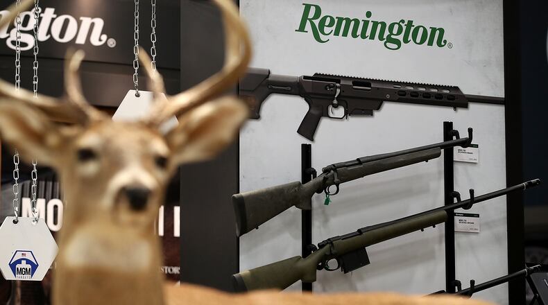 Remington rifles are displayed during the NRA Annual Meeting. On Thursday, The Connecticut Supreme Court ruled that the families of victims killed in the 2012 Sandy Hook Elementary School shooting can sue gun manufacturers, including Remington, for the attack.