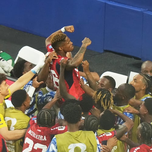 Cape Verde's Helio Varela, top, celebrates scoring his side's second goal against Uruguay during the World Cup Group H soccer match in Miami Gardens, Fla., Sunday, June 21, 2026. (AP Photo/Marta Lavandier)
