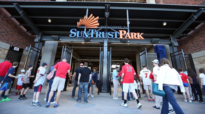 Fans enter SunTrust Park for the Braves-Yankees exhibition game on March 31. JASON GETZ / SPECIAL