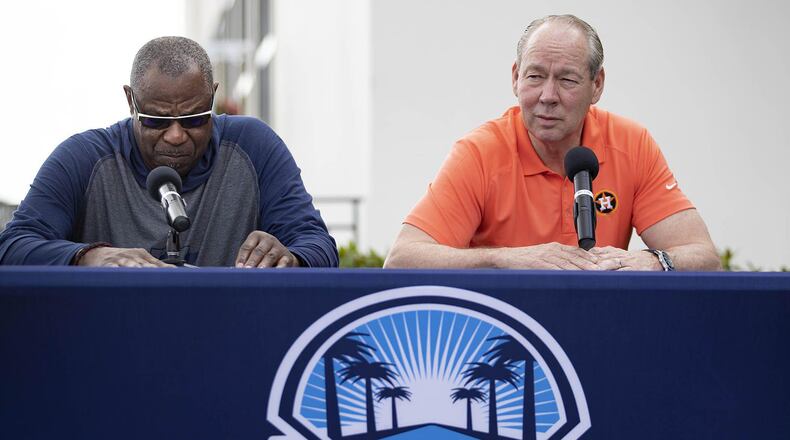 Houston Astros manager Dusty Baker, left, listens as team owner Jim Crane talks during a news conference before the start of spring training at Fitteam Ballpark of the Palm Beaches in West Palm Beach, Fla., on Thursday, Feb. 13, 2020.
