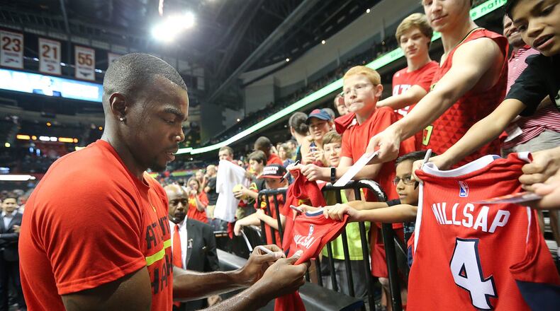 Hawks forward Paul Millsap signs autographs before playing the Cavaliers in Game 4 of a second-round NBA basketball playoff series at Philips Arena on Sunday, May 8, 2016, in Atlanta. Curtis Compton / ccompton@ajc.com