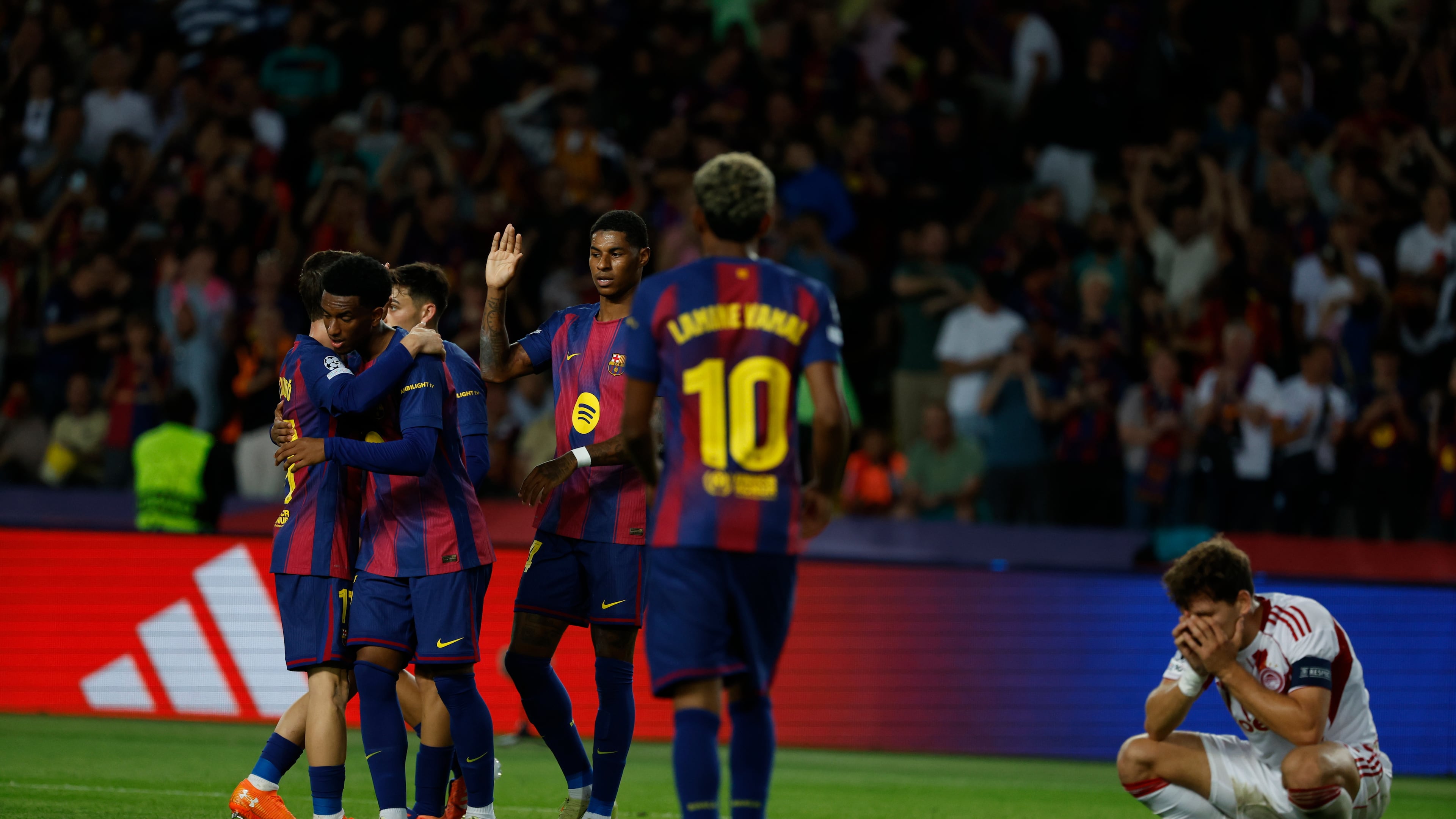 Barcelona's players celebrate the sixth goal of their team during the Champions League opening phase soccer match between Barcelona and Olympiacos in Barcelona, Spain, Tuesday, Oct. 21, 2025. (AP Photo/Joan Monfort)