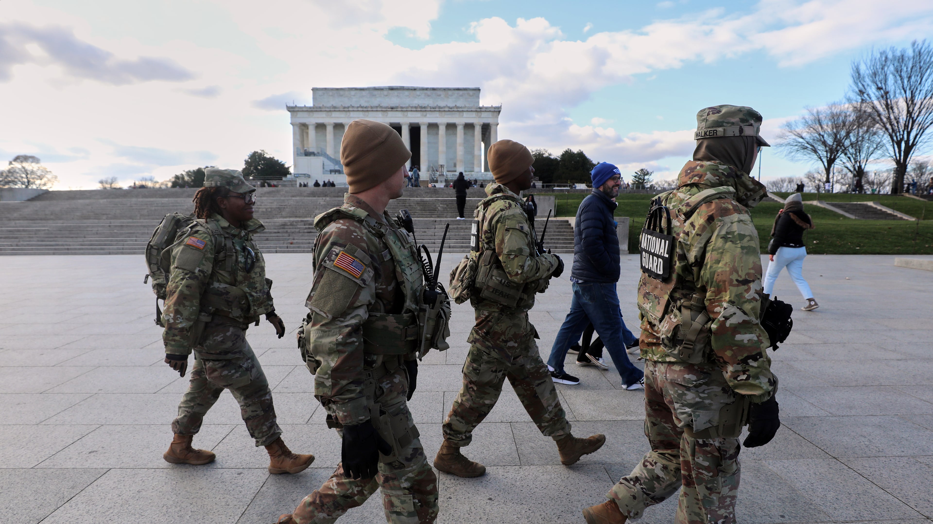 National Guard patrol the National Mall near the Lincoln Memorial, Friday, Nov. 28, 2025, in Washington. (AP Photo/Rahmat Gul)