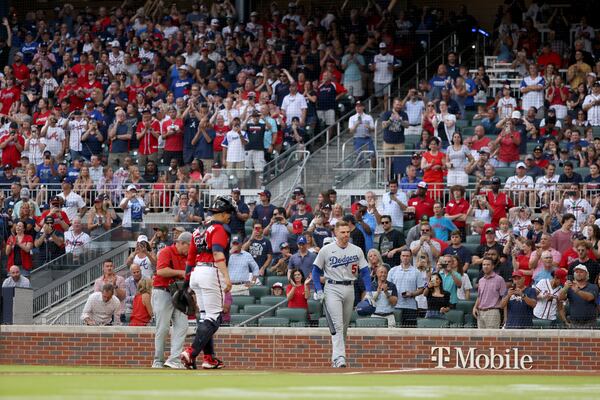  Los Angeles Dodgers first baseman Freddie Freeman reacts to the crowd as Atlanta Braves fans give Freeman a standing ovation before Freeman’s first at bat. (Jason Getz / Jason.Getz@ajc.com)