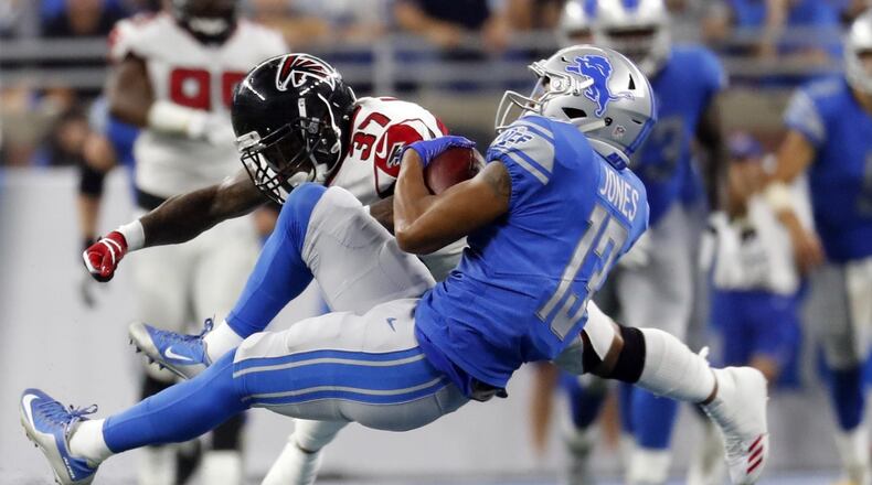 Detroit Lions wide receiver T.J. Jones (13), defended by Atlanta Falcons free safety Ricardo Allen (37), makes a catch during the second half of an NFL football game, Sunday, Sept. 24, 2017, in Detroit. (AP Photo/Paul Sancya)