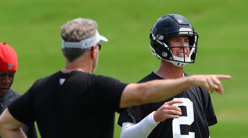 Falcons offensive coordinator Dirk Koetter works with quarterback Matt Ryan during team practice on Thursday, May 23, 2019, in Flowery Branch. Koetter was also the offensive coordinator for the team from 2012 to 2014. Curtis Compton/ccompton@ajc.com