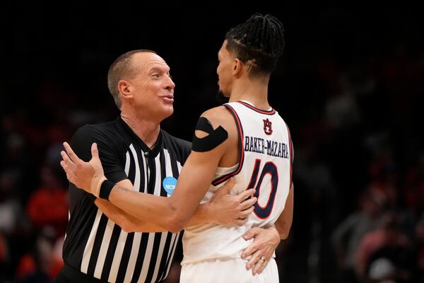 Auburn guard Chad Baker-Mazara (10) speaks with an official during the second half in the Elite Eight of the NCAA college basketball tournament against Michigan State, Sunday, March 30, 2025, in Atlanta. (AP Photo/Brynn Anderson)