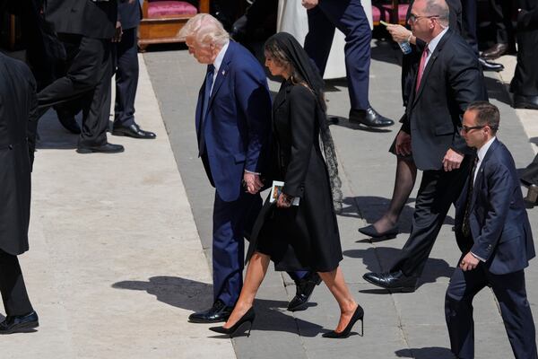 President Donald Trump and first lady Melania Trump leave at the end of the funeral of Pope Francis in St. Peter's Square at the Vatican, Saturday, April 26, 2025. (AP Photo/Gregorio Borgia)