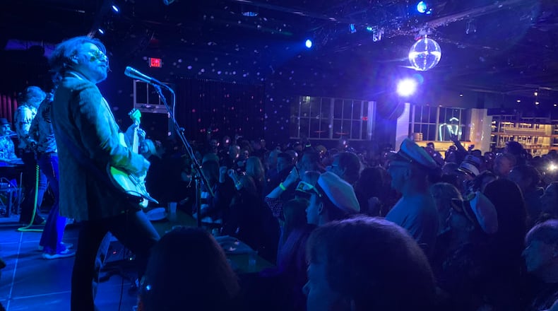 Mark "Monkeyboy" Dannells (left) during the Turkey Eve concert Yacht Rock Revue held at a full Venkman's in Atlanta Nov. 24, 2021. RODNEY HO/rho@ajc.com