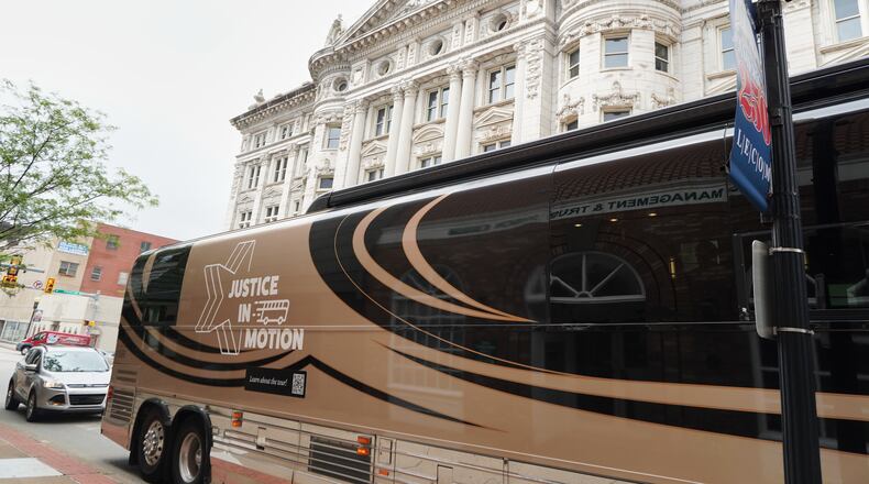 A tour bus carrying retired judges on a tour through the Rust Belt to defend judicial independence is parted outside the Westmoreland County Courthouse in Greensburg, Pa., on Tuesday, July 7, 2026. (Keep Our Republic via AP)