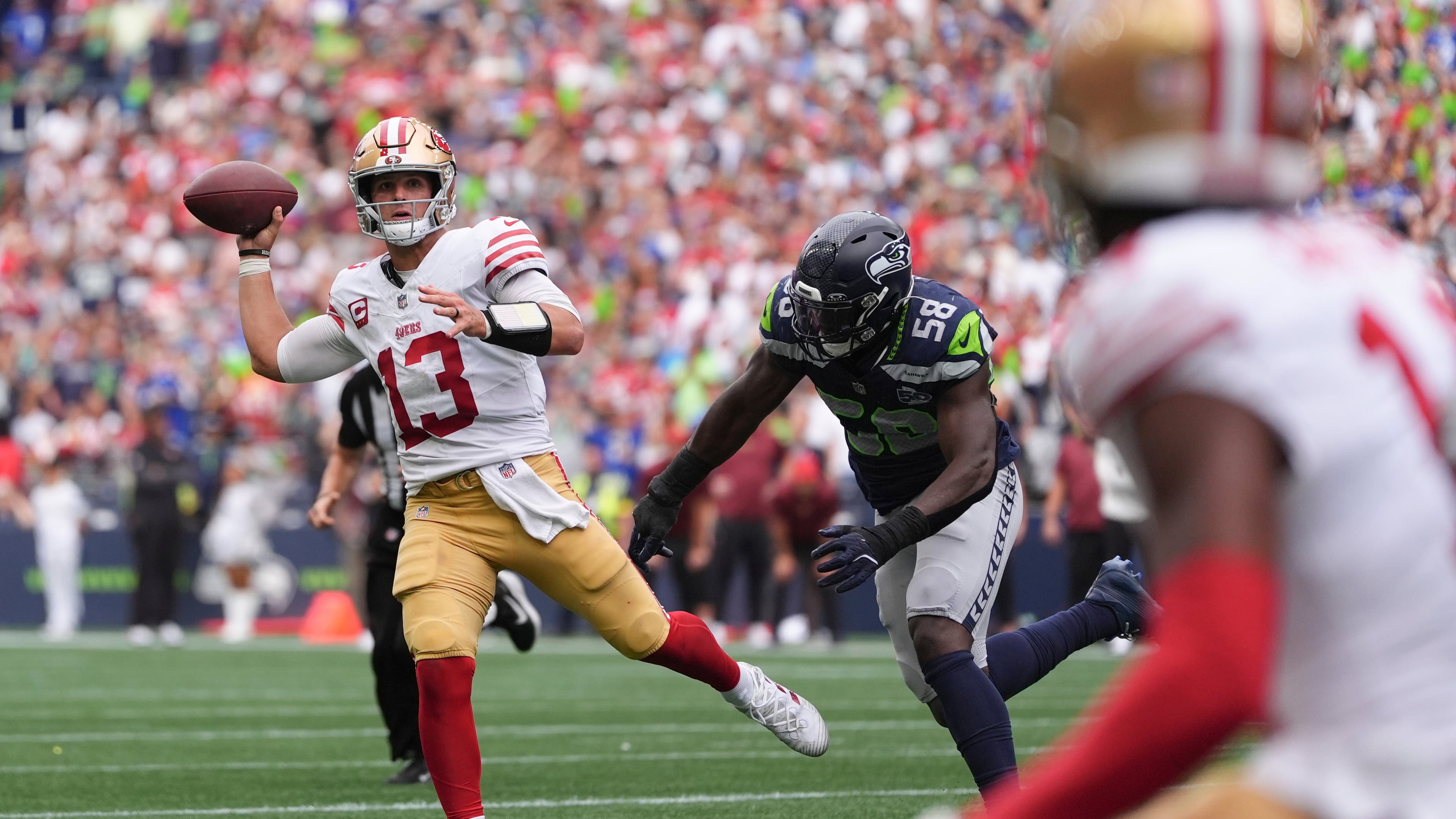 San Francisco 49ers quarterback Brock Purdy (13) throws during the second half of an NFL football game against the Seattle Seahawks, Sunday, Sept. 7, 2025, in Seattle. (AP Photo/Lindsey Wasson)