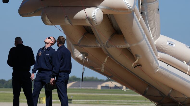 U.S, Air Force personnel work after an emergency inflatable slide deployed before President Donald Trump arrived to board at Joint Base Andrews, Md., Wednesday, Sept. 9, 2026. (AP Photo/Jacquelyn Martin)