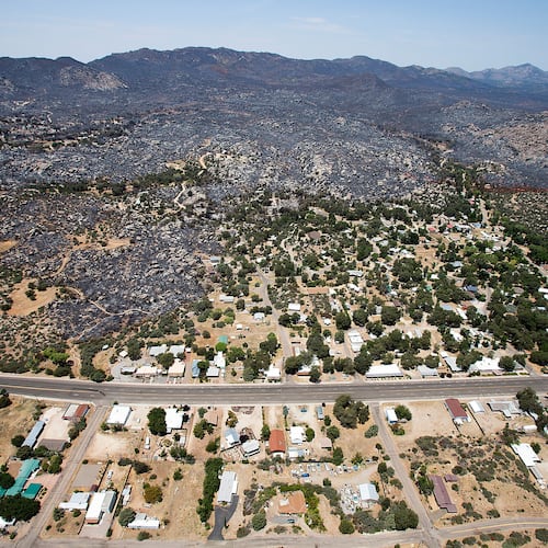 File - This July 3, 2013 aerial file photo shows Yarnell, Ariz. in the aftermath of the Yarnell Hill Fire. (AP Photo/Tom Tingle, File)