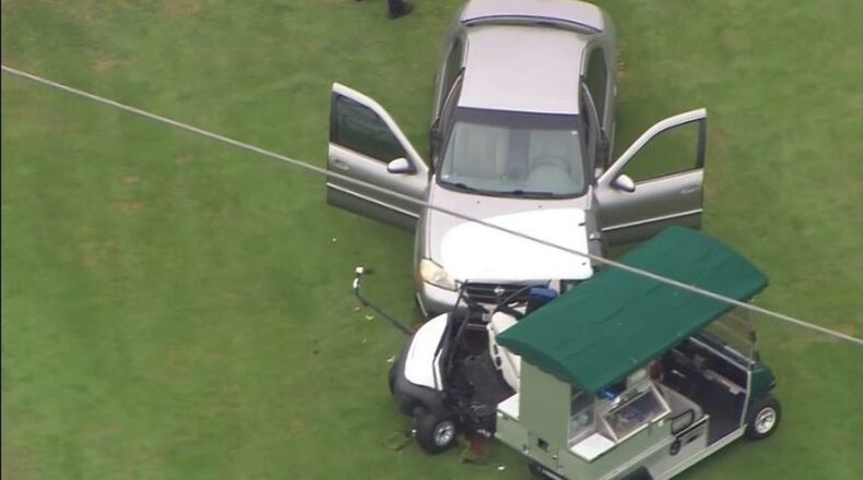 A woman allegedly used her car to strike two carts at a golf course in Lacey, Washington.