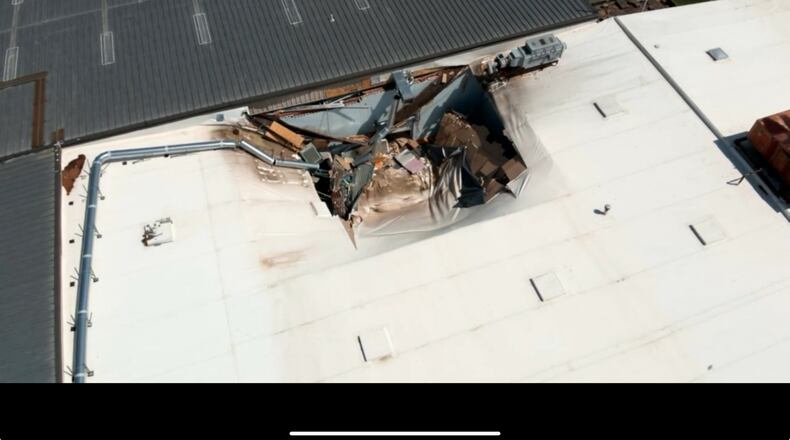 The roof collapse happened at 200 Technology Drive, just outside Alpharetta in Forsyth County, around 1 p.m. Friday.