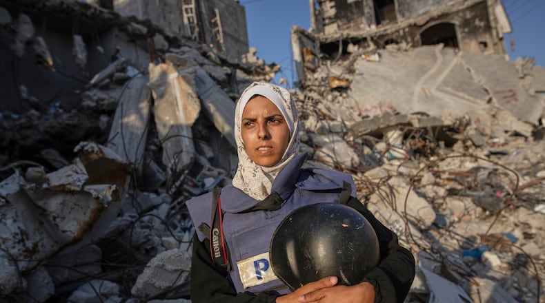 FILE - Freelance journalist Mariam Dagga, 33, who had been working with the Associated Press and other outlets during the Gaza war, poses for a portrait in Khan Younis, southern Gaza Strip, on June 14, 2024. (AP Photo/Jehad Alshrafi, File)