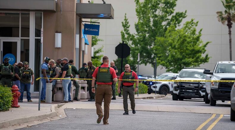 Law enforcement personnel respond to reports of a shooting at Mall of Louisiana in Baton Rouge, La., Thursday, April 23, 2026. (AP Photo/Matthew Hinton)