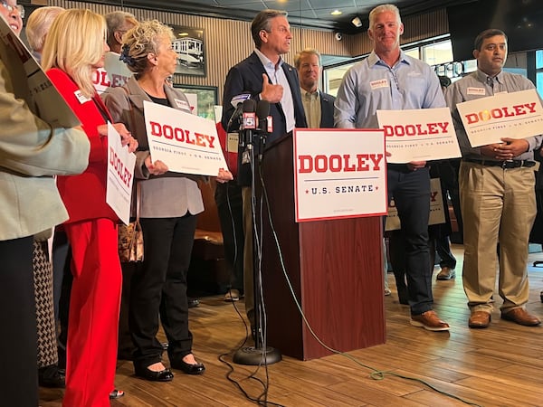 Derek Dooley makes his final case before the GOP primary in Georgia's U.S. Senate race, with Gov. Brian Kemp behind him, at West Cobb Diner in Dallas. (Patricia Murphy/AJC)