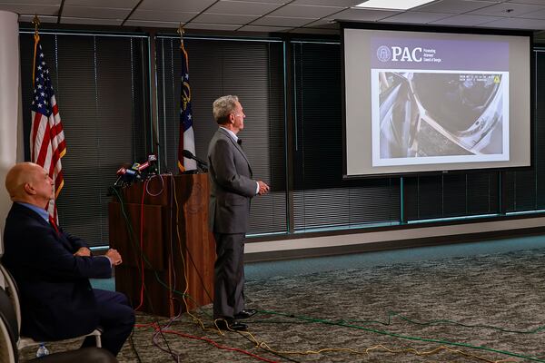 Former Gwinnett District Attorney Daniel J. Porter (right) and Prosecuting Attorneys’ Council of Georgia Executive Director Peter J. Skandalakis (left) discuss video evidence during a press conference announcing the charging decision in the Rayshard Brooks case on Tuesday, August 23, 2022.
