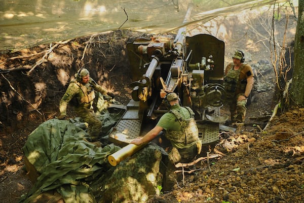 In this photo provided by Ukraine's 127th Separate Brigade of the Territorial Defence press service, soldiers fire a canon towards Russian army positions near Kharkiv, Ukraine, Monday, June 2, 2025, (Anatolii Lysianskyi/Ukraine's 127th Separate Brigade via AP)