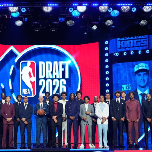 Prospective draftees pose for a group photo with NBA Commissioner Adam Silver, center, before the first round of the NBA basketball draft, Tuesday, June 23, 2026, in New York. (AP Photo/Yuki Iwamura)