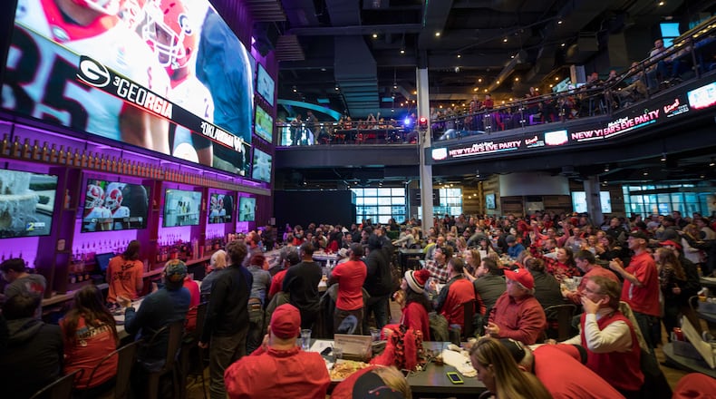 Georgia fans during a watch party at Sports & Social restaurant before Georgia plays Oklahoma in the Rose Bowl in Pasadena, Jan. 1, 2018, in Atlanta. After the win, people went bananas.