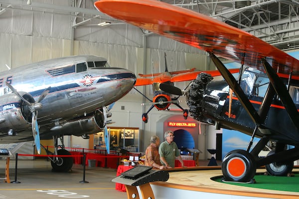061214 ATLANTA: The Douglas DC-3 Ship 41 (from left to right), and Northeast Airlines Stinson SR-8E Reliant built in 1936, and a restored 1931 Curtiss-Wright 6B Sedan that celebrates the Travel Air that flew Delta's first passengers on June 17, 1929 are on display at the Delta Flight Museum on Thursday, June 12, 2014, in Atlanta. The iconic DC-3's spreed, range and passenger capacity. Ship 41 is the only remaining. Delta passenger DC-3. CURTIS COMPTON / CCOMPTON@AJC.COM