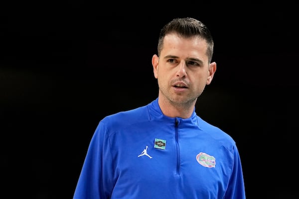 Florida head coach Todd Golden watches against Auburn during the first half in the national semifinals at the Final Four of the NCAA college basketball tournament, Saturday, April 5, 2025, in San Antonio. (AP Photo/Brynn Anderson)