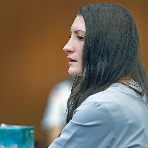 Lindsay Clancy tries to hold back tears as details of the murder of her three children are given in court during her murder trial at Plymouth Superior Court in Plymouth, Mass., Thursday, Aug. 27, 2026. (Greg Derr/The Patriot Ledger via AP, Pool)