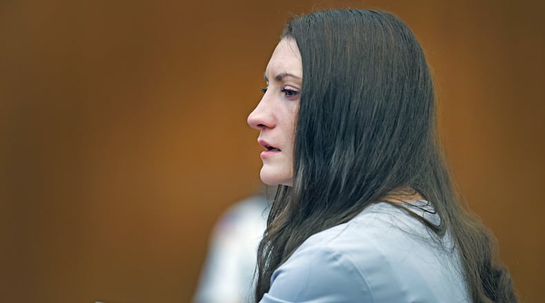 Lindsay Clancy tries to hold back tears as details of the murder of her three children are given in court during her murder trial at Plymouth Superior Court in Plymouth, Mass., Thursday, Aug. 27, 2026. (Greg Derr/The Patriot Ledger via AP, Pool)