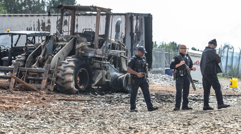 Atlanta police and construction personnel were on the construction site of the police training center on March 6, 2023 in Atlanta examining equipment set on fire and destroyed by protests. (John Spink / John.Spink@ajc.com)