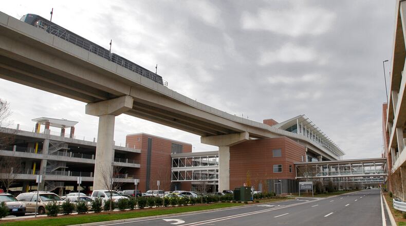 091207 - Atlanta - An ATL SkyTrain moves down the rail Monday, December 7, 2009 as the airport prepared for the December 8th, grand opening of the new, state-of-the-art rental car center and the ATL SkyTrain. When the new facility opens, all rental car companies operating in the passenger terminal will move to the rental car center. The center will house all customer transaction counters and all vehicles for rental agencies that operate at Hartsfield-Jackson. John Spink, jspink@ajc.com.