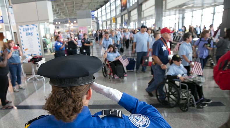 TSA Honor Guard Sergeant Yahaira Vargas salutes members of Honor Flight Austin as they turn toward their gate at Austin Bergstrom International Airport on Friday, October 07, 2016. Honor Flight Austin is taking their first all-women veterans' flight to visit memorials in Washington, DC. Honor Flight Austin is a non-profit organization created to honor veterans by transporting them to visit their war memorials. Honor Flight Austin serves veterans residing within Bastrop, Bell, Blanco, Burnet, Caldwell, Fayette, Gillespie, Gonzales, Hays, Lee, Llano, Milam, Travis and Williamson Counties. DEBORAH CANNON / AMERICAN STATESMAN