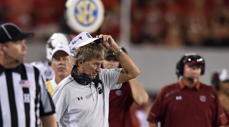 Steve Spurrier contemplates what to do with his visor in September’s 52-20 loss to Georgia on Sept. 19, 2015. (Brant Sanderlin/AJC staff)