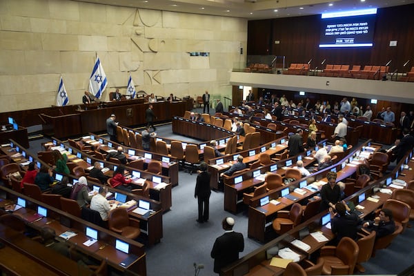 Lawmakers attend a session of the Knesset, Israel's parliament, in Jerusalem, Monday, July 14, 2025. (AP Photo/Ohad Zwigenberg)