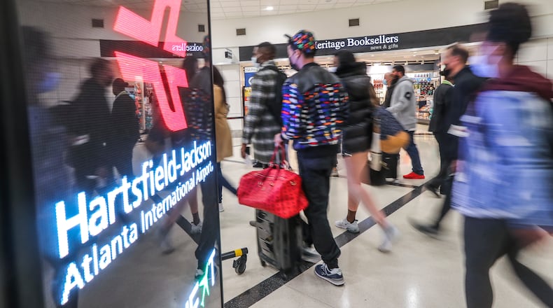 This recent photo shows travelers at the domestic side of Hartsfield-Jackson International Airport as the Airport is preparing for busy Thanksgiving travel period.  ( John Spink / John.Spink@ajc.com)
