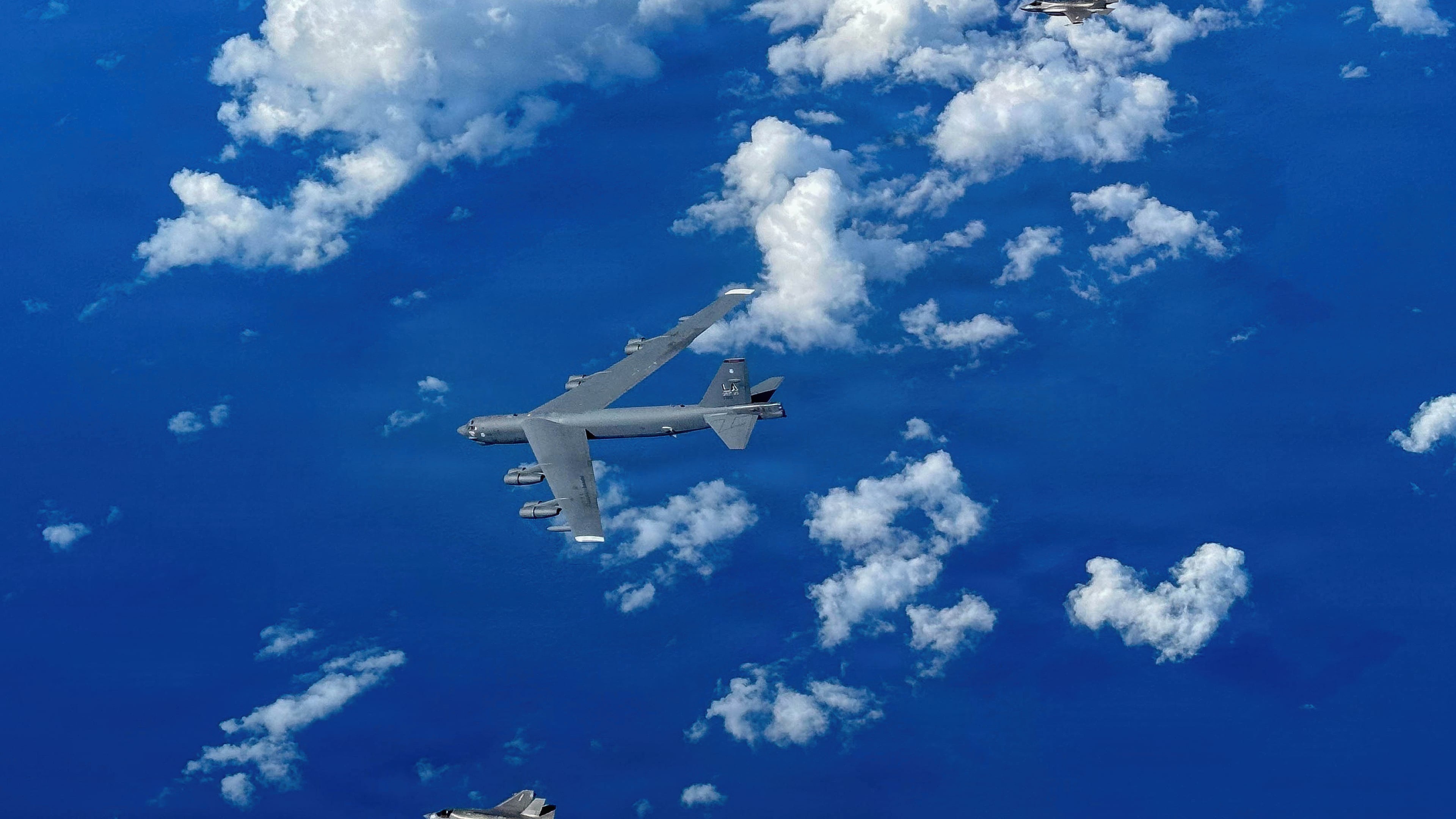 In this image provided by the U.S. Air Force, A Marine Corps F-35B Lightning II aircraft flies alongside a U.S. Air Force B-52H Stratofortress bomber in the U.S. Southern Command area of responsibility, Oct. 15, 2025. (U.S. Air Force via AP)