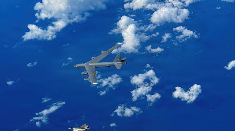 In this image provided by the U.S. Air Force, A Marine Corps F-35B Lightning II aircraft flies alongside a U.S. Air Force B-52H Stratofortress bomber in the U.S. Southern Command area of responsibility, Oct. 15, 2025. (U.S. Air Force via AP)