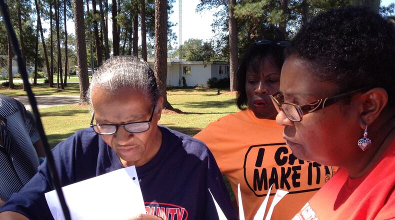 Brooks County School Board members Linda Troutman, Diane Thomas and Nancy Dennard scan maps and voter lists as they and other activists set out to campaign door-to-door in Morven, Ga. on Saturday, Oct. 4, 2014. ARIEL HART / AHART@AJC.COM