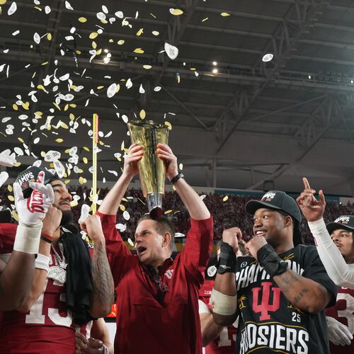 Indiana head coach Curt Cignetti holds the trophy after their win against Miami in the College Football Playoff national championship game, Monday, Jan. 19, 2026, in Miami Gardens, Fla. (AP Photo/Rebecca Blackwell)