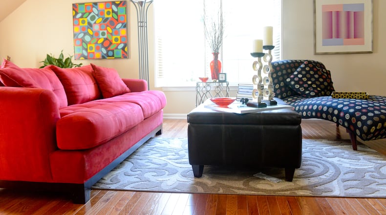 When they bought their townhome, Jeffrey Chandler and Pedro Ayestaran Diaz changed the flooring in the upstairs bonus room from carpet to wood. The wood floors helped transform the space into a spacious and chic sitting area. Text by Lori Johnston and Keith Still/Fast Copy News Service. (Christopher Oquendo Photography/www.ophotography.com)