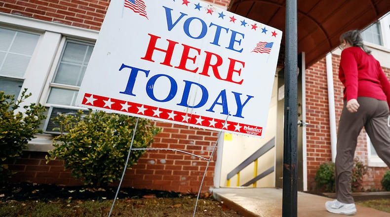A person enters the Israel Baptist Church in Kirkwood during election day on Tuesday. Miguel Martinez / miguel.martinezjimenez@ajc.com