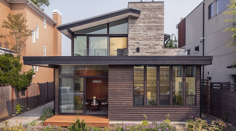 Ainslie-Davis Construction built a home in Madison Park for Allison Ainslie and her family that’s a “do-over” of the midcentury-modern home her father, Hugh Ainslie, built for his family in 1967, just a few blocks away. “The original house was designed by Tony Callison, who was a friend of my father at the University of Washington,” says Allison’s brother Neill Ainslie. (Steve Ringman/The Seattle Times/TNS)