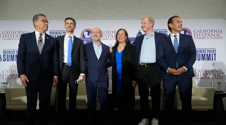 From left, Xavier Becerra, Matt Mahan, Steve Hilton, Betty Yee, Tom Steyer and Antonio Villaraigosa pose during a gubernatorial candidate forum in Sacramento, Calif., Tuesday, April 14, 2026. (AP Photo/Godofredo A. Vásquez)