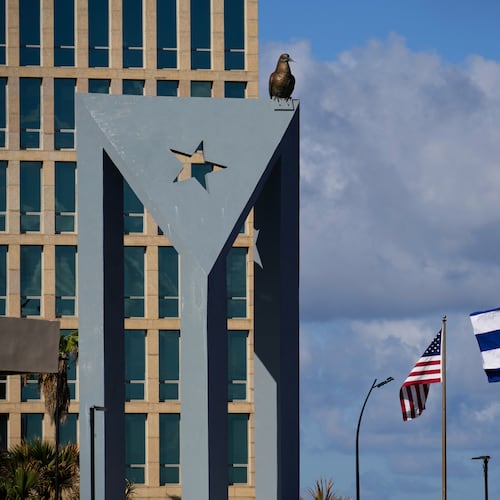 The Cuban flag flies at half-mast at the Anti-Imperialist Tribune near the U.S. embassy in Havana, Cuba, Monday, Jan. 5, 2026, in memory of Cubans who died two days before in Caracas, Venezuela during the capture of Venezuelan President Nicolas Maduro by U.S. forces. (AP Photo/Ramon Espinosa)