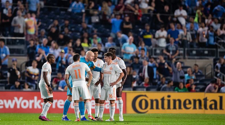 Atlanta United goalkeeper Brad Guzan huddles with teammates during the first half Wednesday, Sept. 25, 2019, against NYCFC at Yankee Stadium in New York.