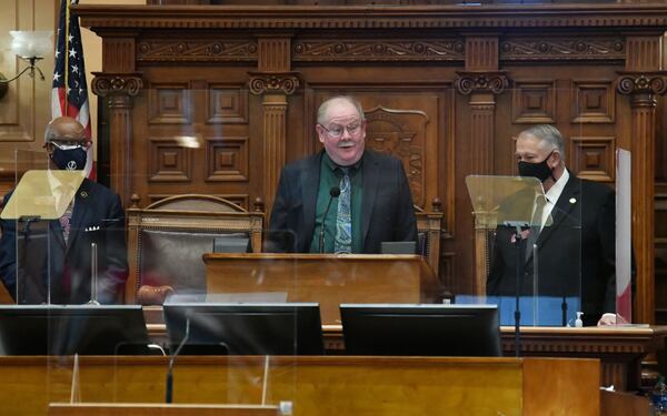 Jim Galloway, AJC political columnist, speaks after he was recognized and honored as Rep. Calvin Smyre (left) and David Ralston, speaker of the House, look on in the House chambers during the 2021 legislative session at the Georgia State Capitol building on Thursday, January 14, 2021. (Hyosub Shin/AJC)